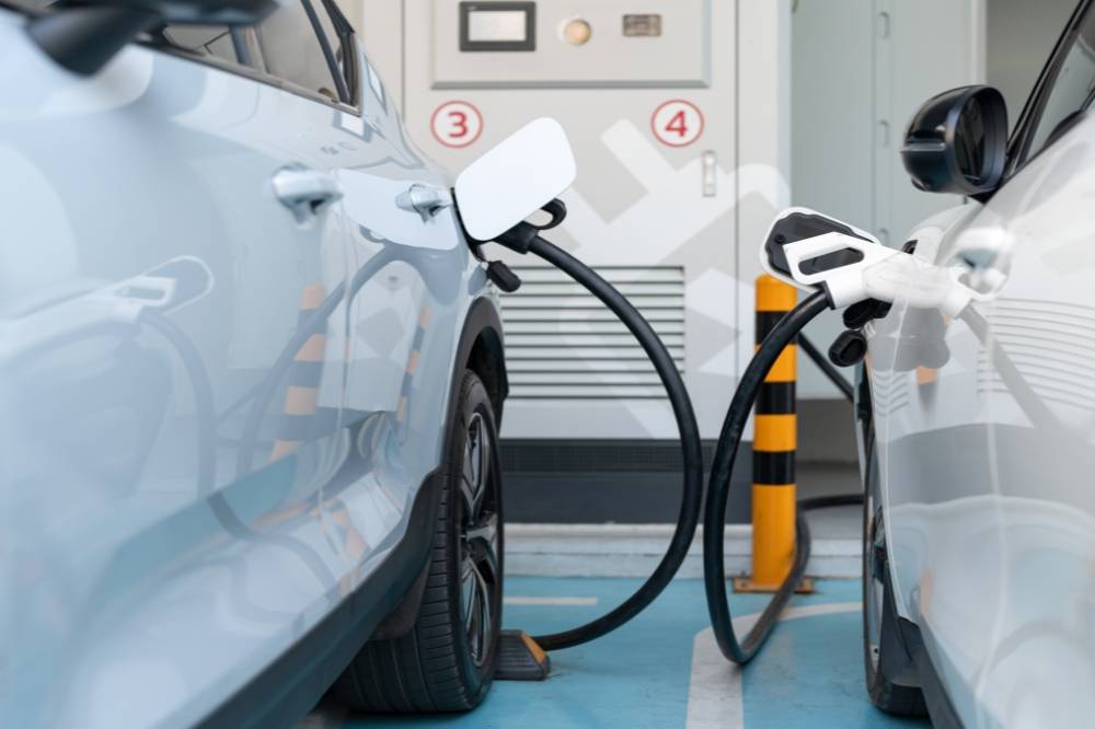 As EVs gain global popularity, Malaysian consumers are left wondering whether to buy now or wait. Photo edited via Canva 