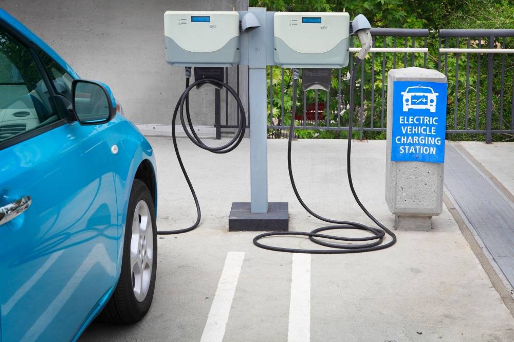 While the growth of public charging stations and infrastructure in urban and semi-urban areas is moving at an encouraging rate, crucial backend systems such as maintenance, regulatory enforcement and consumer protection; are still struggling to keep up. - Photo edited via Canva