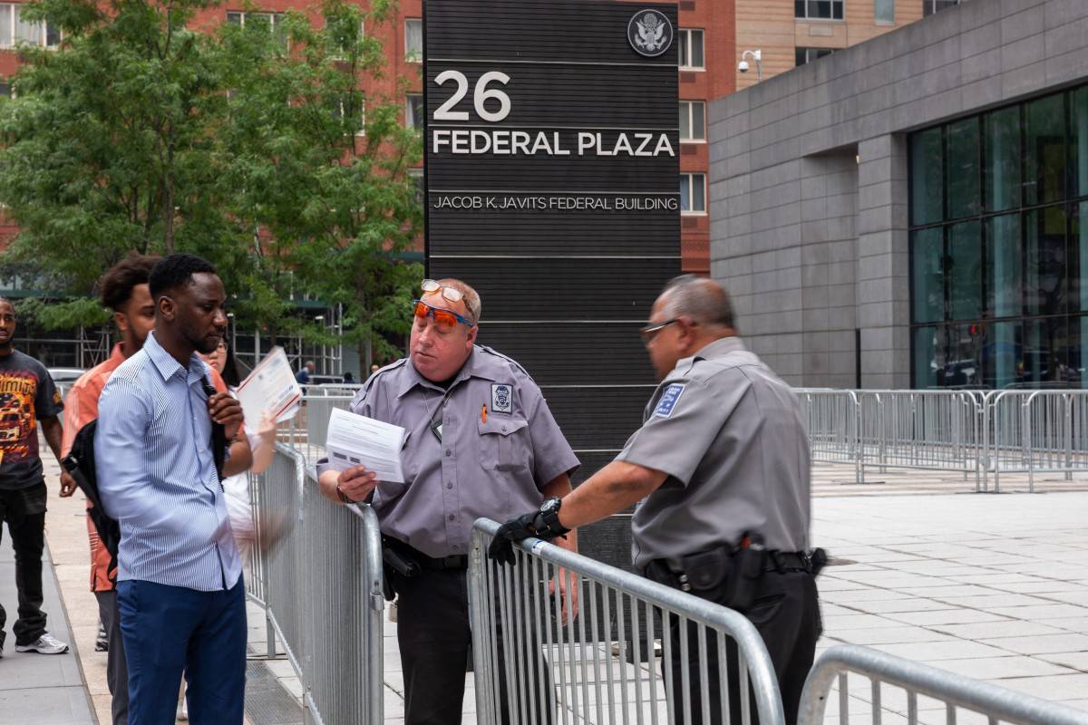 People go through security while heading into the Jacob K. Javitz Federal Building, which is home to immigration courts and where federal agents have been detaining dozens of people weekly on Aug 5, 2025 in New York City. - (Photo by SPENCER PLATT / Getty Images via AFP)