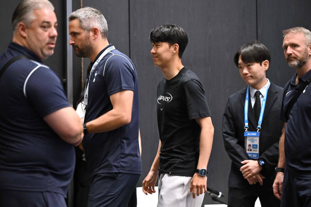 Tottenham Hotspur's Son Heung-min (C) leaves after a pre-match press conference in Seoul on August 2, 2025, ahead of the friendly football match between Newcastle United and Tottenham Hotspur. (Photo by Jung Yeon-je / AFP)