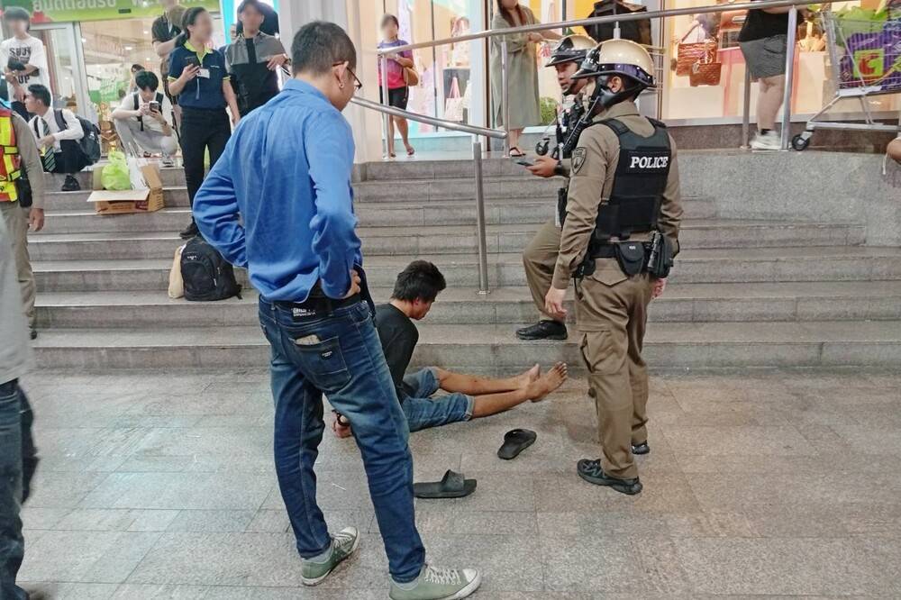 A Thai man is arrested by police after dousing two Malaysian tourists with paint thinner and setting them on fire outside a shopping mall at Ratchaprasong intersection, Bangkok, on Aug 7. Photo: X