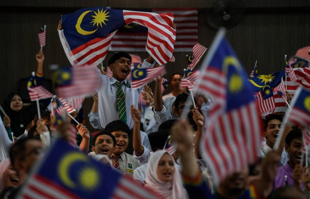 Some students of Sekolah Menengah Kebangsaan Jitra waved the Jalur Gemilang while attending the 2025 Kedah State-level Kembara Merdeka Jalur Gemilang programme here recently.