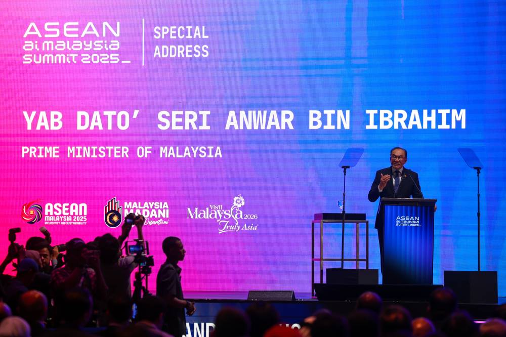 Prime Minister Datuk Seri Anwar Ibrahim delivers his keynote address at the official launch of the ASEAN AI Malaysia Summit 2025 at the Malaysia International Trade and Exhibition Centre, today. - Photo by Bernama