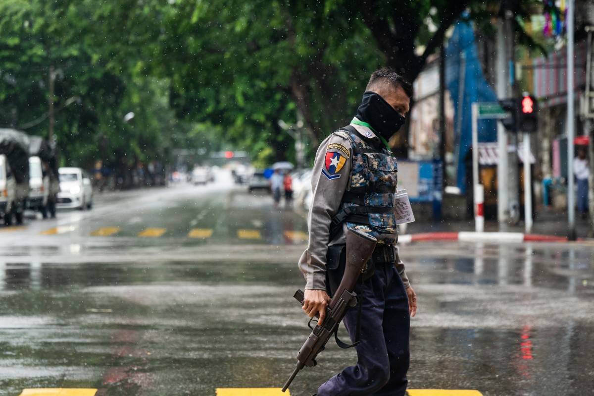 A policeman walks on a street in Yangon, Myanmar on July 19, 2025. - (Photo by AFP)