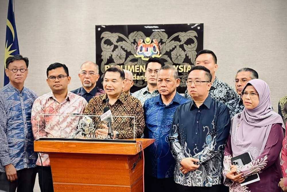 Rafizi (centre) during a press conference at the Parliament building on Thursday.