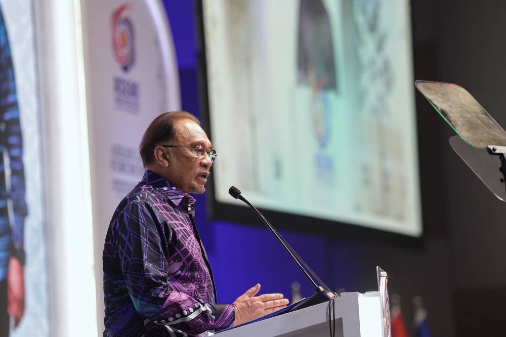Prime Minister Datuk Seri Anwar Ibrahim delivers his speech at the ASEAN Law Forum 2025 themed Enhancing Access to Justice in the ASEAN Economic Community: Bridging Legal Cooperation for Inclusive Growth in the Digital Age in Kuala Lumpur Convention Centre today. - Photo by Bernama