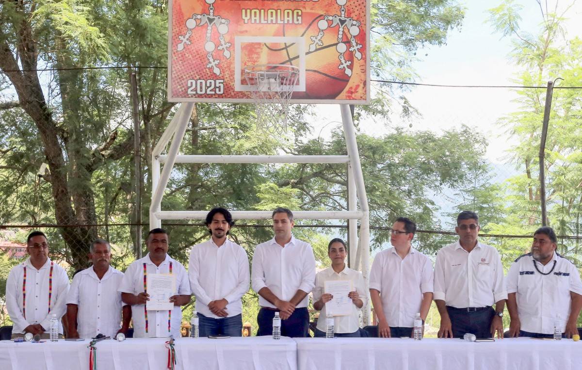Handout picture released by Secretaria de Culturas y Artes de Oaxaca shows (L to R) Juan Maldonado, legal advisor; Jacobo Lopez; Eric Ignacio Fabian, municipal president of Villa Hidalgo Yalalag; Pablo Caballero, Adidas Brand Director; Alejandro Ibarra, Adidas Team Coordinator; Karen Gonzalez, Adidas Legal Director; Marco del Valle, Adidas Public Affairs Coordinator; Raul Ruz, Secretary of Economic Development of the State of Oaxaca; and Flavio Sosa, Secretary of Culture and Arts of Oaxaca, attend a public hearing to receive an apology from the German sportswear brand Adidas, in the community of Villa Hidalgo Yalalag, Oaxaca state, Mexico on August 21, 2025. German brand Adidas publicly apologized to an indigenous community in Mexico on August 21 for using its traditional sandals as inspiration for a new design, which artisans and authorities denounced as cultural appropriation. (Photo by Francisco Reyna Lucero / Secretaría de Culturas y Artes de Oaxaca / AFP)