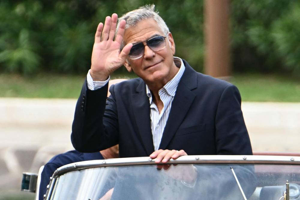 US actor George Clooney arrives at the Excelsior pier during the 82nd Venice International Film Festival at Venice Lido, on August 27, 2025. (Photo by Stefano RELLANDINI / AFP)
