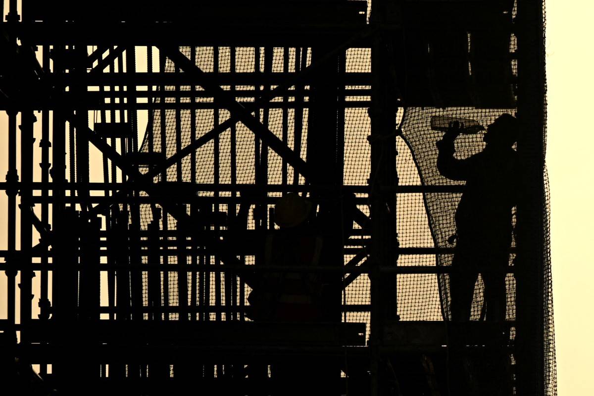 A labourer drinks water as he works at a construction site of the 'Chennai Metro Rail' project in Chennai on July 11, 2025. (Photo by R.Satish BABU / AFP)