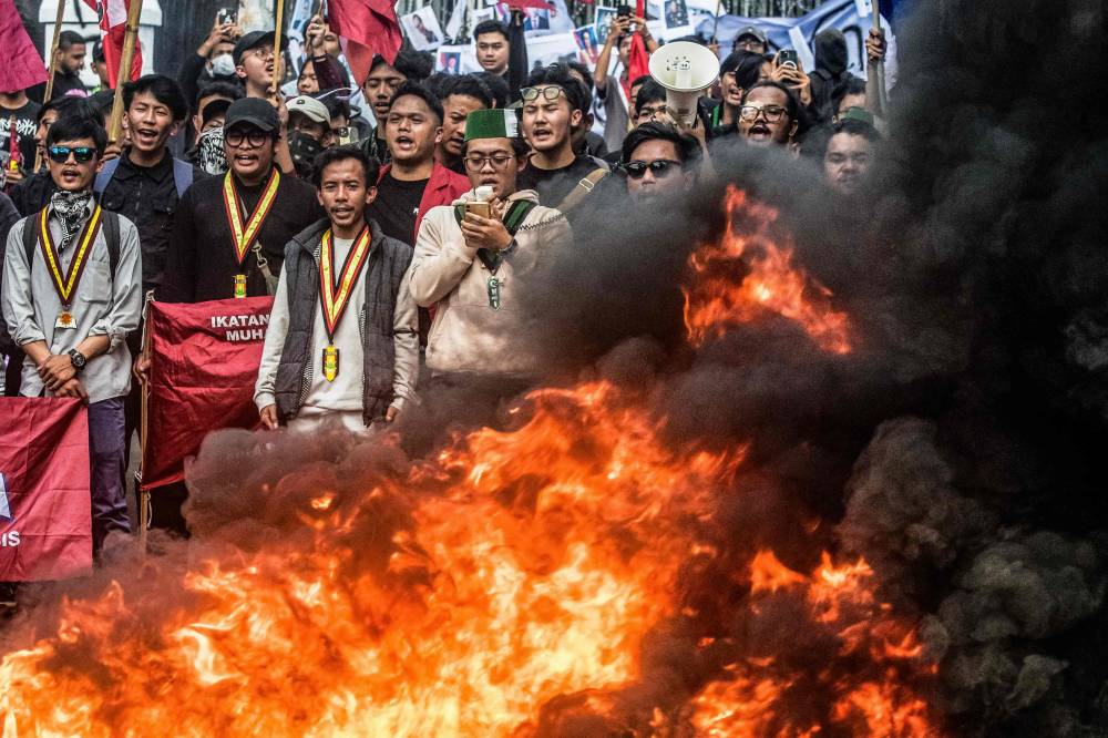Demonstrators shout slogans during a protest demanding police reform and the dissolution of the parliament, in Bandung, West Java. Photo by AFP