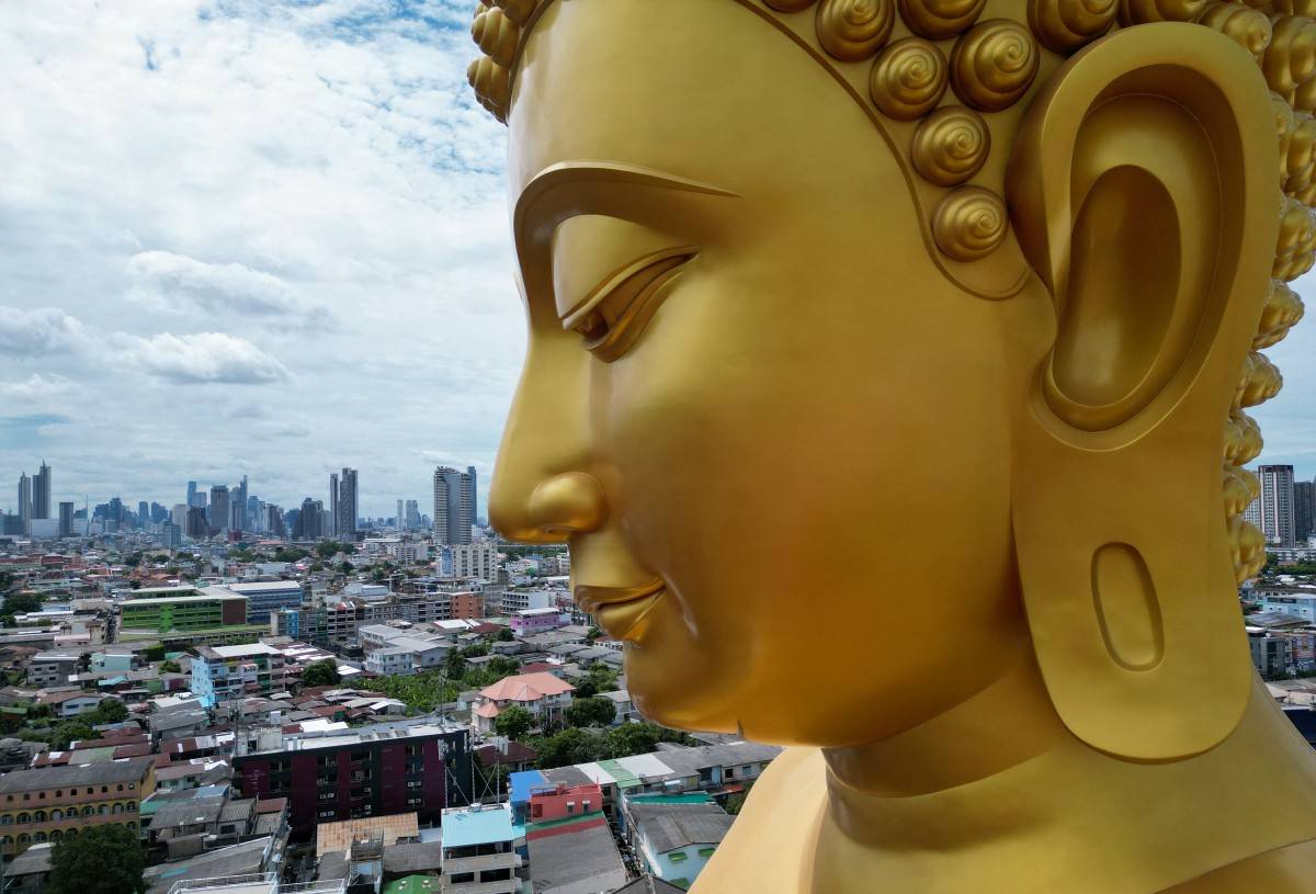 This aerial photo taken on July 18, 2025 shows the giant Buddha statue at the Wat Paknam Phasi Charoen Buddhist temple complex in Bangkok. (Photo by Watsamon TRI-YASAKDA / AFP)