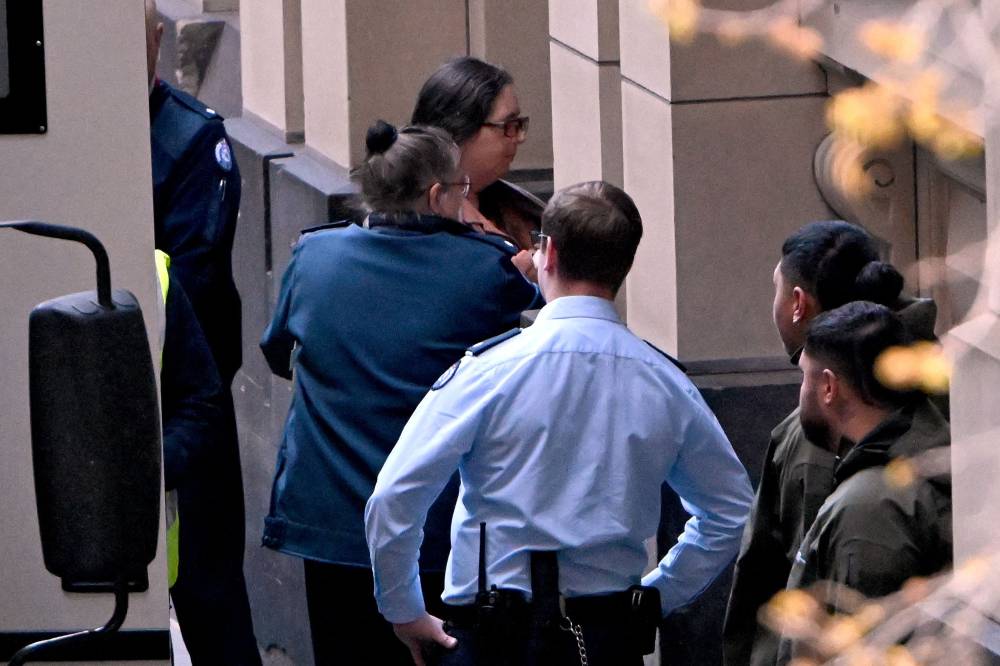 Convicted murderer Erin Patterson (top, C) arrives at the Supreme Court of Victoria in Melbourne on Sept 8. (Photo by WILLIAM WEST / AFP)