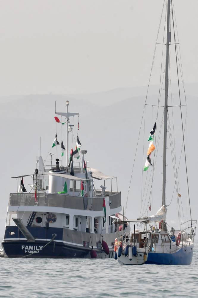 A ship, known as the "Family" and is part of the Global Sumud Flotilla, is anchored off the coast of the village of Sidi Bou Said. Photo by Fethi Belaid/AFP