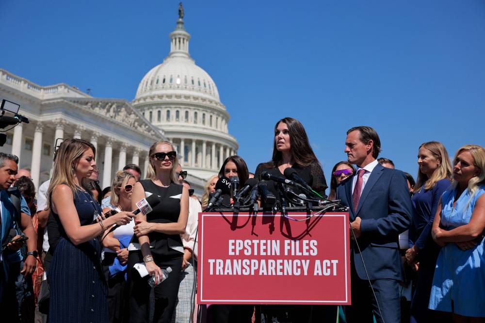 Teresa Helm (C) speaks during a news conference with fellow alleged victims of disgraced financier and sex trafficker Jeffrey Epstein, their lawyers, supporters and members of Congress outside the US Capitol on Sept 3, 2025 in Washington, DC. - (Photo by CHIP SOMODEVILLA / Getty Images via AFP)