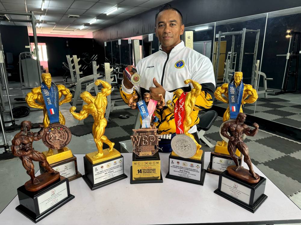 Amin Rasuad with several of his international trophies, bringing pride to the nation. - Bernama photo