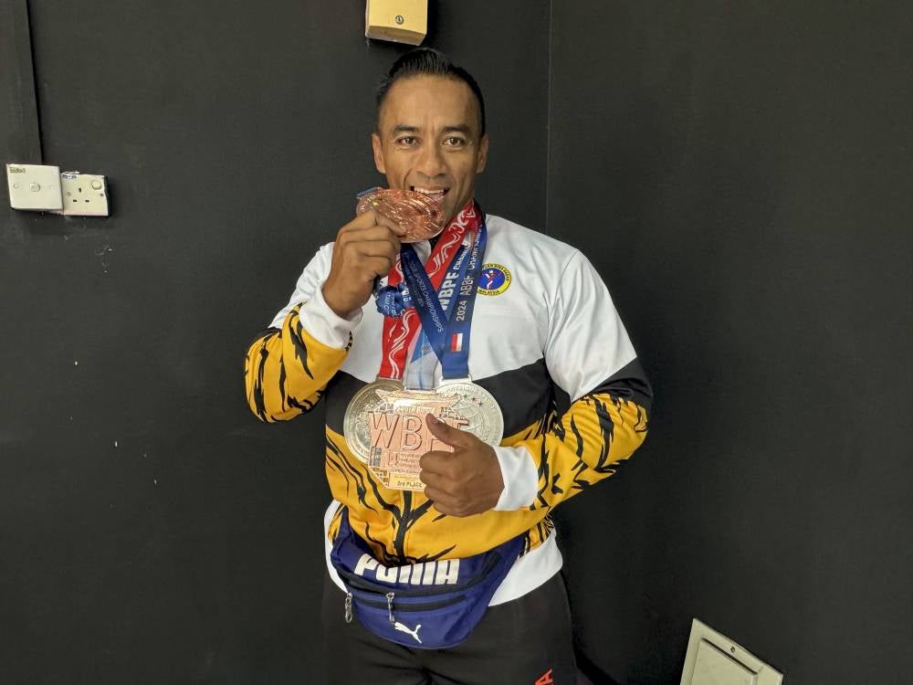 Amin Rasuad with his medals won at the international level since representing Malaysia in the sport beginning in 2022. - Bernama photo