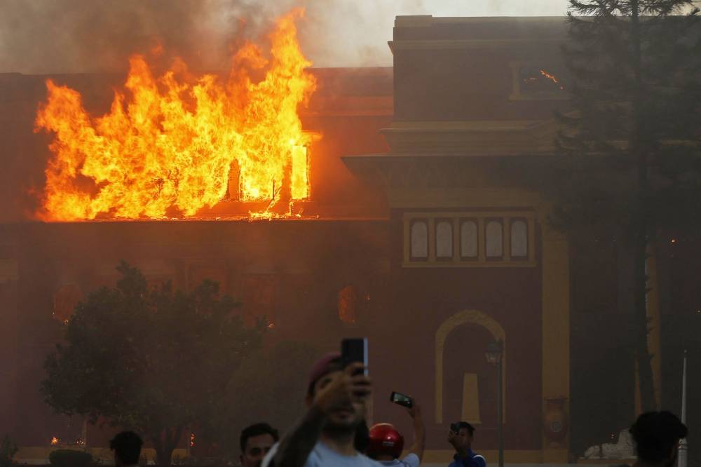 On Sept 9, smoke rose from Nepal’s President House after protesters set it ablaze during violent rallies against social media bans and corruption that left 22 dead and forced the prime minister to resign. - (Photo by PRABIN RANABHAT / AFP)