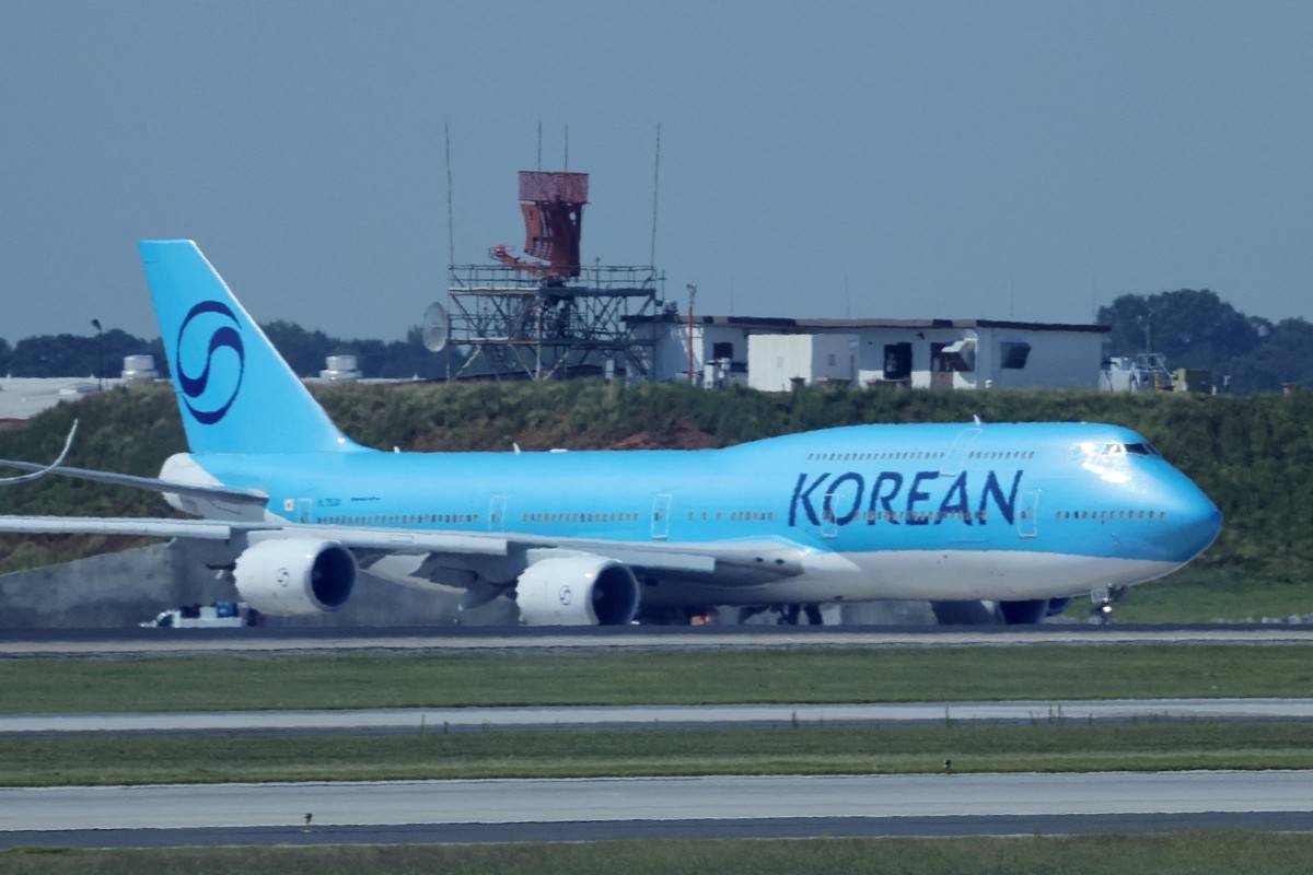 A chartered Korean Air Boeing 747-8I plane carrying hundreds of South Korean workers freed after a US immigration raid taxies at Hartsfield-Jackson Atlanta International Airport in Atlanta, Georgia on Sept 11, before taking off for Incheon International Airport. (Photo by YONHAP / AFP)