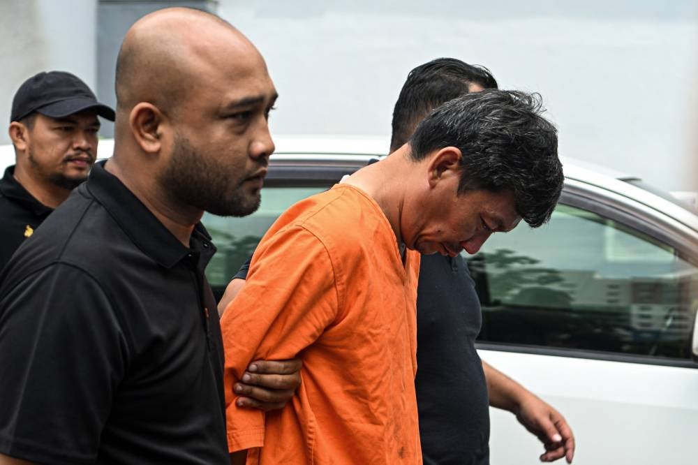 A 46-year-old father pleaded not guilty at the Sessions Court here today to a charge of causing the death of his two children at the estuary of Sungai Linggi, Tanjung Agas, Port Dickson, on Sept 4. Photo by Bernama