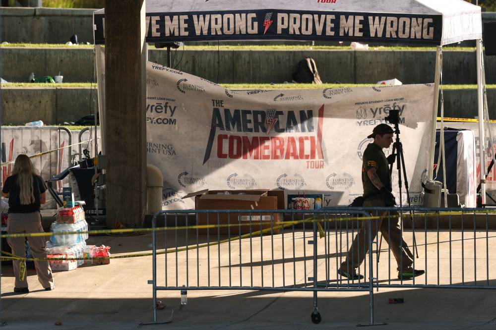 Law enforcement officials, including members of an FBI forensics team, work near the crime scene where political activist Charlie Kirk was shot and killed at Utah Valley University in Orem, Utah, on Sept 11, 2025. - (Photo by Patrick T. Fallon / AFP)