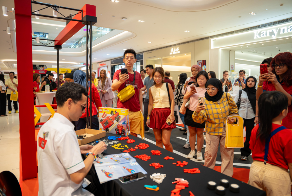 Master Model Builder Zariq Mohd Ali building the world's first Lego Ferari from 1998.
