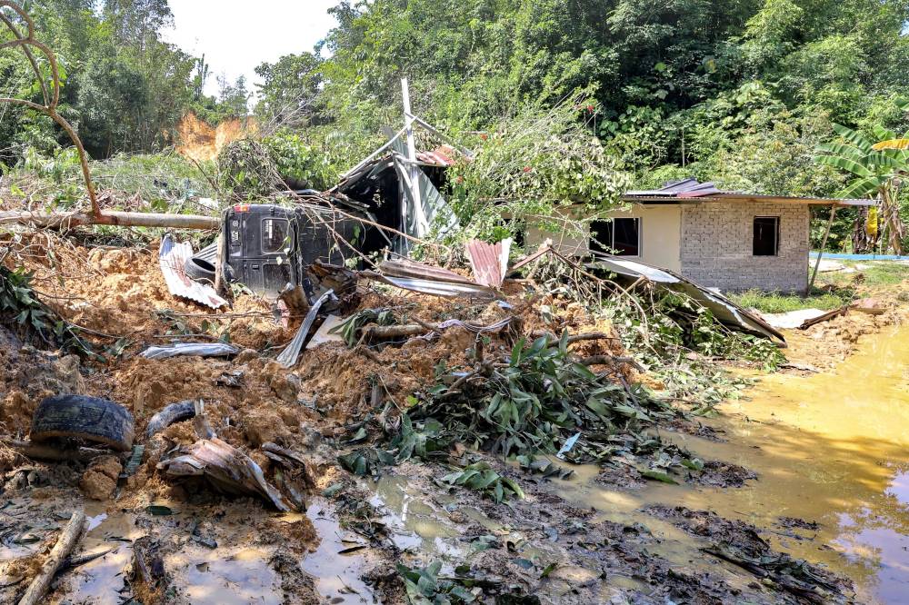 The landslide site that claimed the lives of a mother and son in Kampung Mook, Kinarut. Photo by Bernama