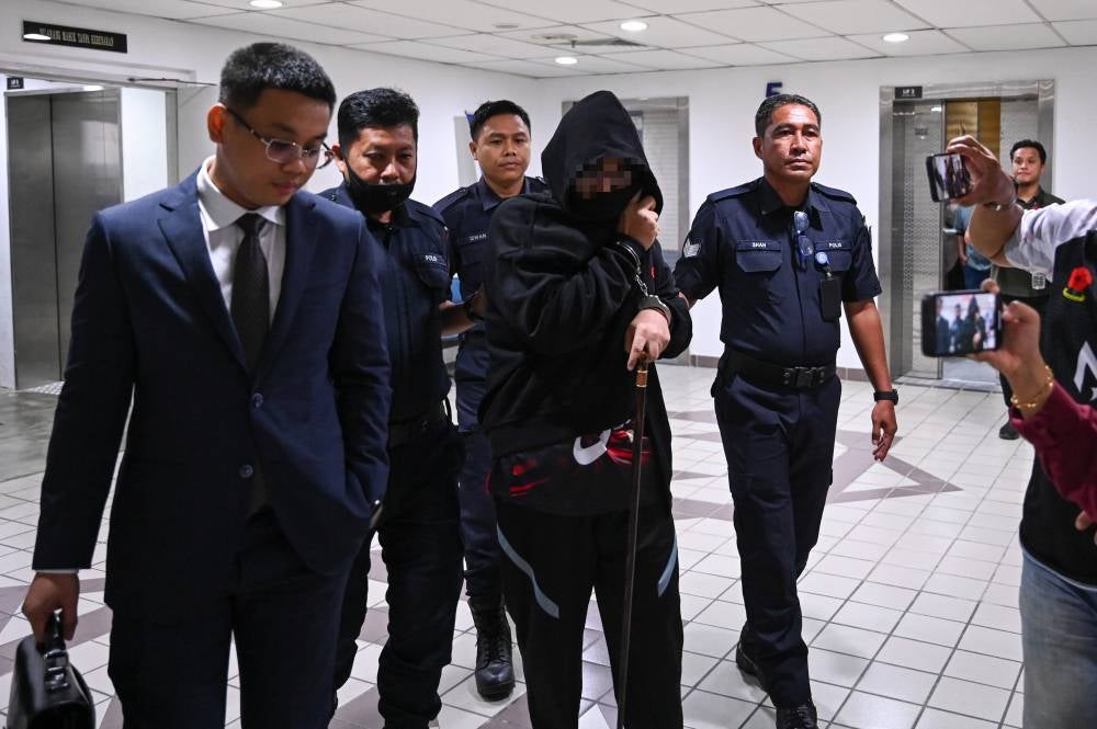 Teacher of a religious school Mohamad Aswadi Yah, 46, pleaded not guilty in the Sessions Court today to two counts of physical sexual assault. - Photo by Bernama