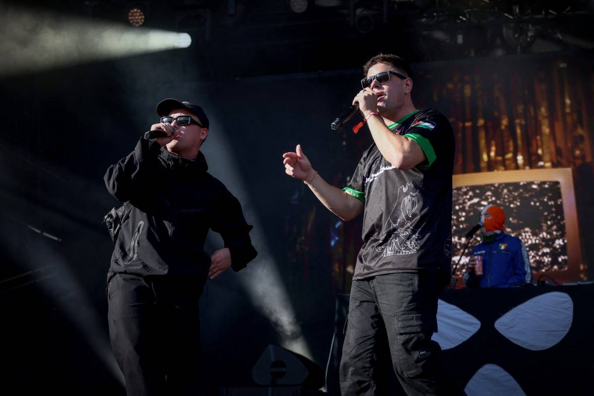 Northern Ireland hip-hop trio Kneecap perform on stage at the Rock en Seine music festival, in Saint-Cloud, near Paris, on Aug 24. - (Photo by GUILLAUME BAPTISTE / AFP)