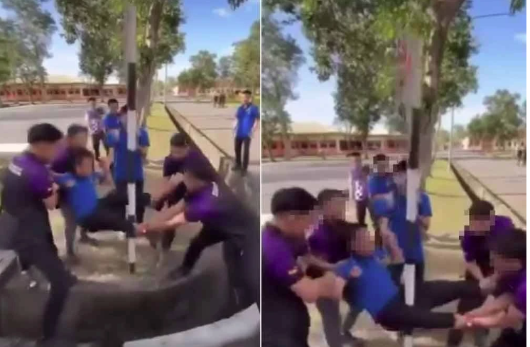 A viral video showed five students holding the arms and legs of another student and deliberately swinging his groin area towards a signpost.