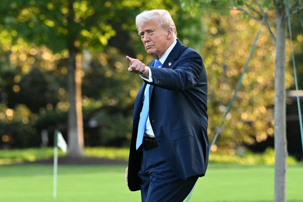 US President Donald Trump walks to board Marine One as he departs from the South Lawn of the White House in Washington, DC, on Sept 22, 2025. - (Photo by SAUL LOEB / AFP)