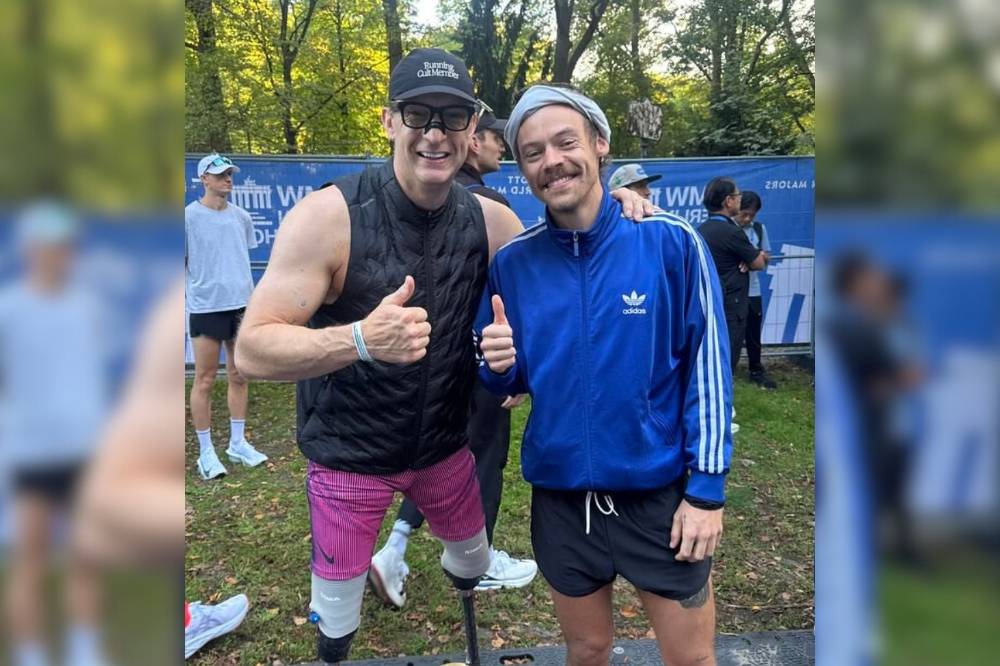 Styles crossed the finish line roughly a minute behind Paralympian Richard Whitehead (left). - Photo: X