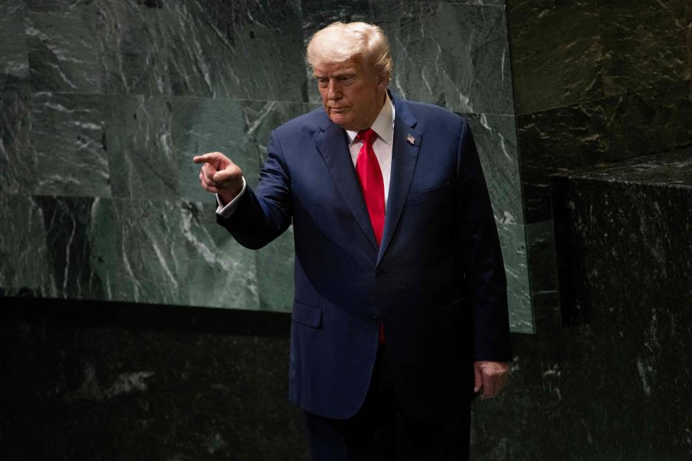 US President Donald Trump points to attendees after delivering remarks to the United Nations General Assembly at the UN headquarters in New York City on Sept 23, 2025. - (Photo by Brendan Smialowski / AFP)