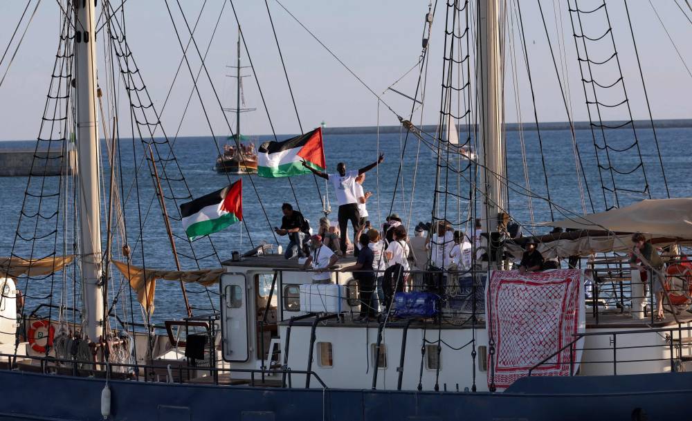 The first vessel "Sirius" of a civilian flotilla, carrying pro-Palestinian activists and humanitarian aid and aiming to break the Israeli blockade of the Gaza Strip, leaves the Barcelona port on Sept 1, 2025, after being forced to return due to bad weather. - (Photo by LLUIS GENE / AFP)