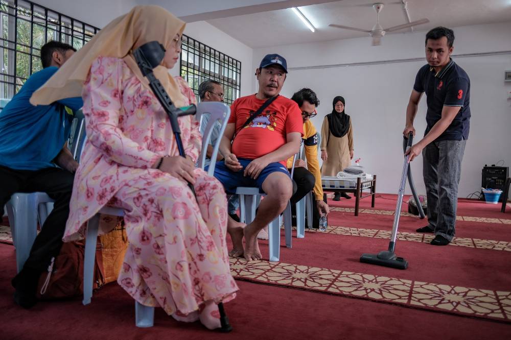 A former resort telephone operator who lost his job during the Covid-19 pandemic, Abdul Haziq (right) said the programme has given him fresh hope of returning to the workforce after several years of unemployment.