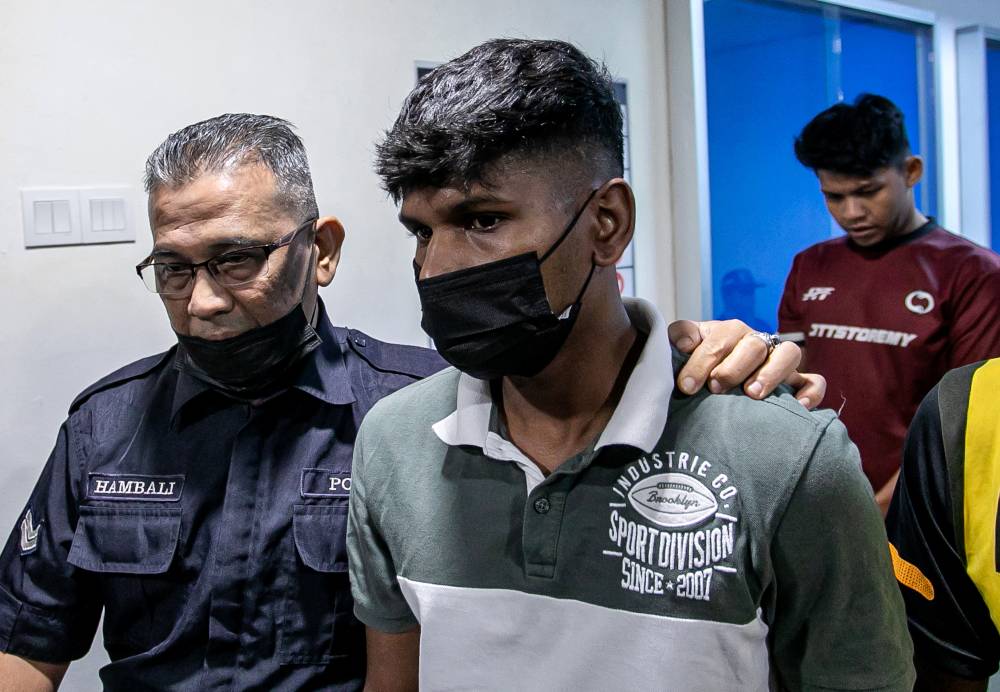 Mechanic M. Thineshkumar, 23, was fined RM20,000 by the Magistrate’s Court after pleading guilty to a charge of beating a dog to death last month. - Photo by Bernama