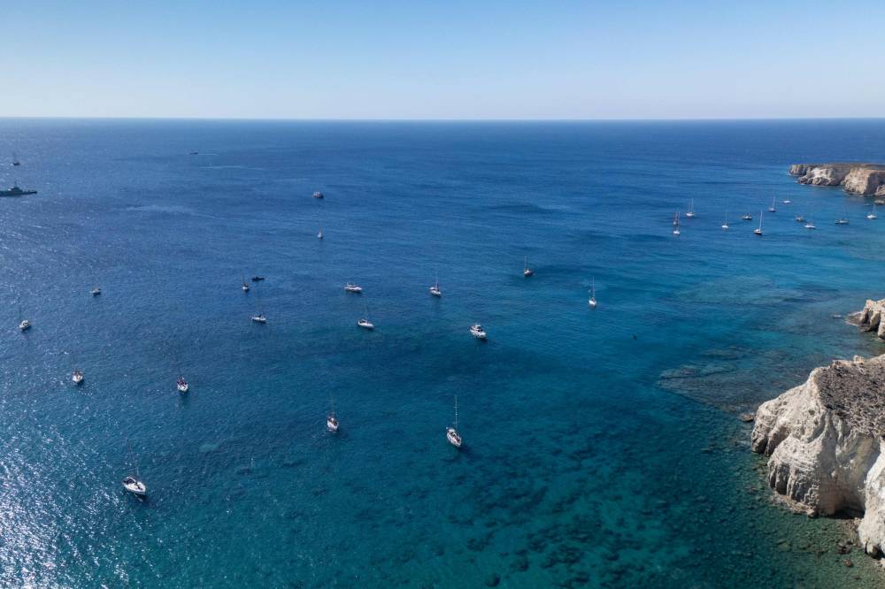 A group of ships of the Global Sumud Flotilla to Gaza are shown moored at the small island of Koufonisi, south of the island of Crete on Sept 26. Photo by Eleftherios Elis/AFP