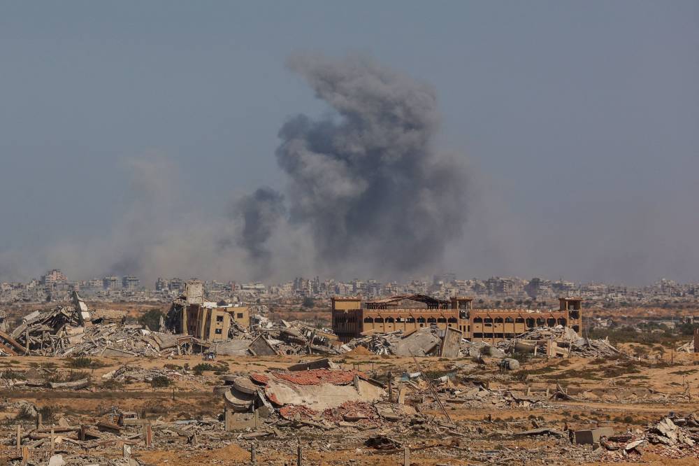 Smoke billows following an Israeli strike in Gaza City, on Oct 2, 2025, as pictured from Nuseirat in central Gaza. Photo by Omar Al-Qattaa/AFP