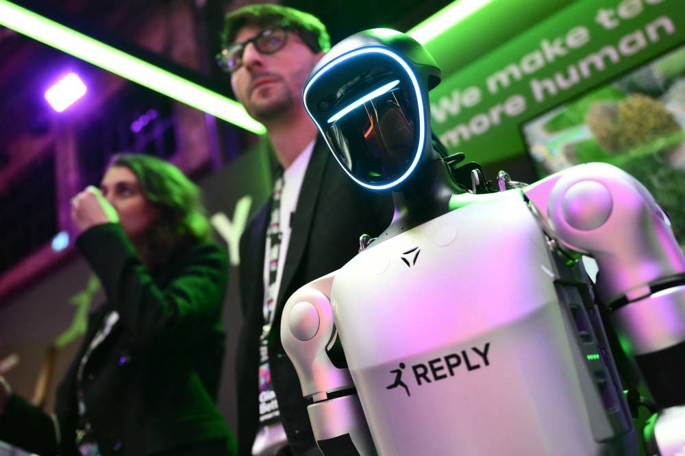 Robot G1 Unitree, by Italian company Reply, is displayed during the Italian Tech Week 2025 at OGR Officine Grandi Riparazioni, in Turin on October 3, 2025. The Italian Tech Week, one of the most important tech conferences in Europe, brings together more than 15,000 people every year to discuss the latest developments in AI, space, climate, mobility, and health. (Photo by MARCO BERTORELLO / AFP)
