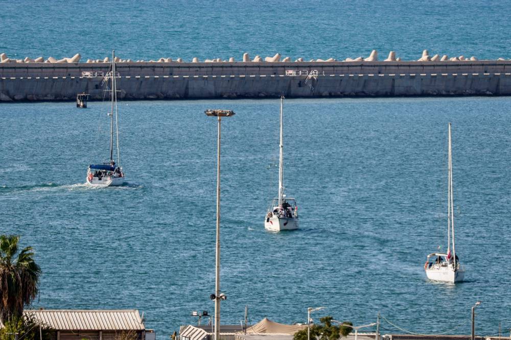 Boats from the Global Sumud Flotilla intercepted by Israeli forces in the Mediterranean sea off the Gaza Strip waters, arrive in the southern port of Ashdod on Oct 2, 2025. - (Photo by Saeed QAQ / AFP)