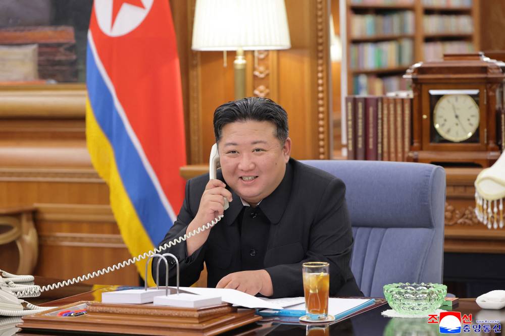 This picture taken on Aug 12, 2025 and released by North Korea's official Korean Central News Agency (KCNA) on Aug 13, 2025 shows North Korean leader Kim Jong Un holding a telephone conversation with Russian President Vladimir Putin at an undisclosed location in North Korea. Photo by KCNA VIA KNS/AFP FILE PIX