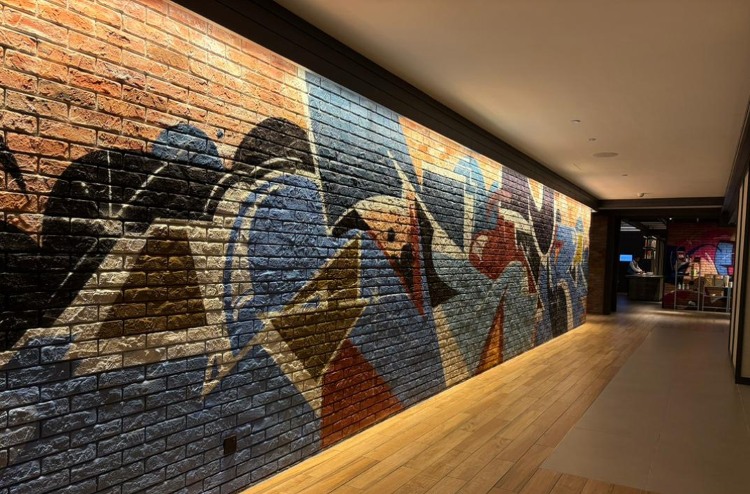 Jeff’s murals inject bursts of local energy into the hotel’s industrial-chic design.
