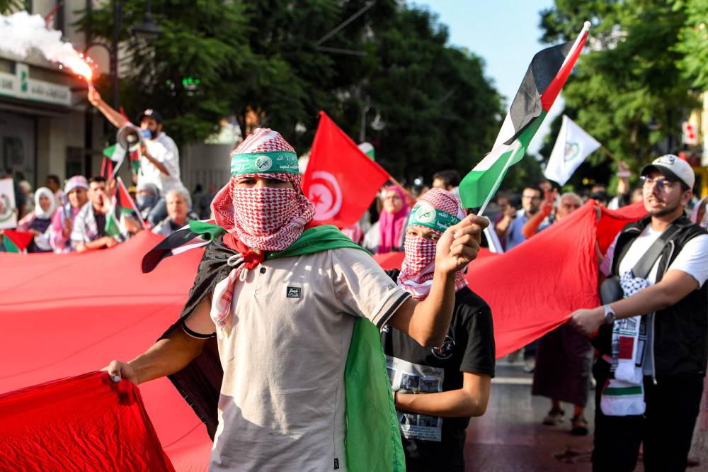 Demonstrators gather for a rally condemning Israel's interception of the Global Sumud Flotilla (GSF), which was bound for the Gaza Strip, outside the French embassy headquarters at the Place de l'Independence (Independence Square) in central Tunis on Oct 4. Photo by Fethi Belaid/AFP