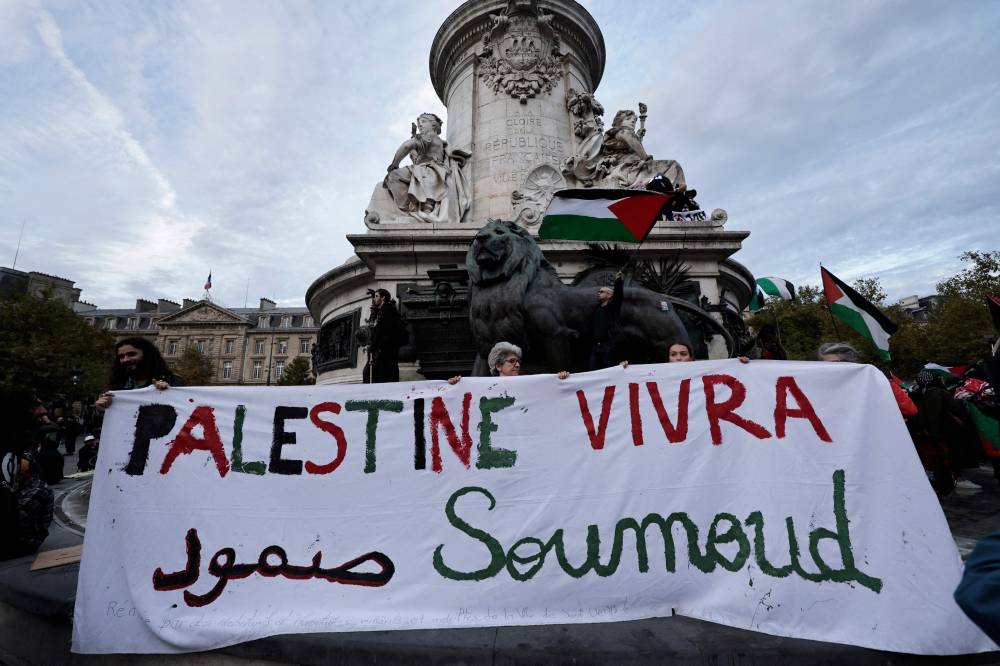 Participants hold a banner reading 