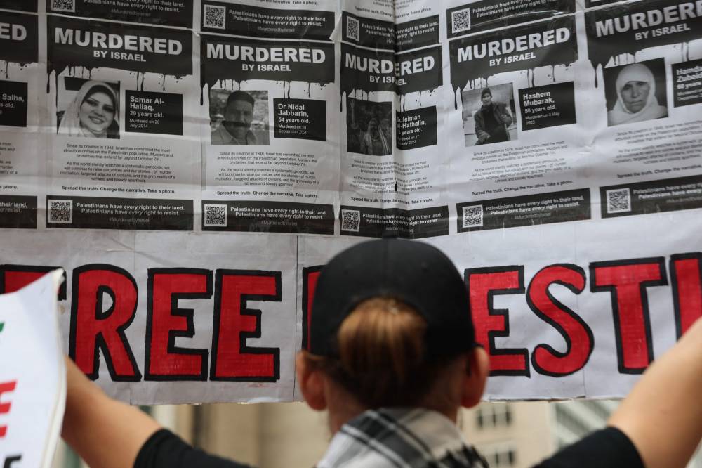 Pro-Palestinian activists protest the war in Gaza on the Oct 7th Anniversary at the Newscorp headquarters in New York City. Photo by Michael M. Santiago/Getty Images/AFP