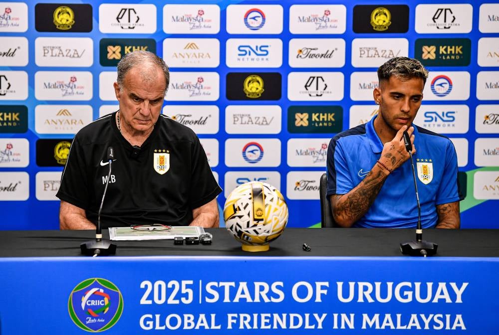 Uruguay head coach Marcelo Bielsa (left) and player Rodrigo Zalazar (right) respond to questions during the pre-match press conference for the ‘Stars of Uruguay: Global Friendly in Malaysia’ at the National Stadium in Bukit Jalil today. - Bernama photo