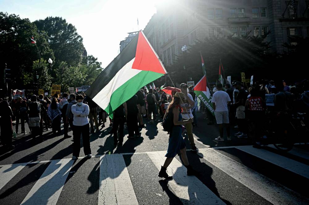 Protestors rally against Israeli Prime Minister Benjamin Netanyahu ahead of his meeting with US President Donald Trump in front of the White House in Washington, DC on July 6. Photo by Brendan Smialowski/AFP FILE PIX
