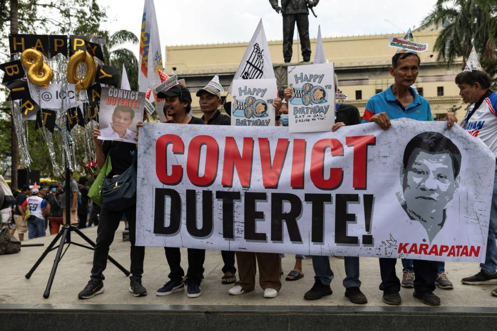 People take part in a demonstration that coincides with the 80th birthday of former Philippine president Rodrigo Duterte, to call for justice and his conviction by the ICC of the charge tied to his "war on drugs" in which thousands were killed, at the Liwasang Bonifacio in Manila on March 28, 2025. - (Photo by Earvin Perias / AFP)