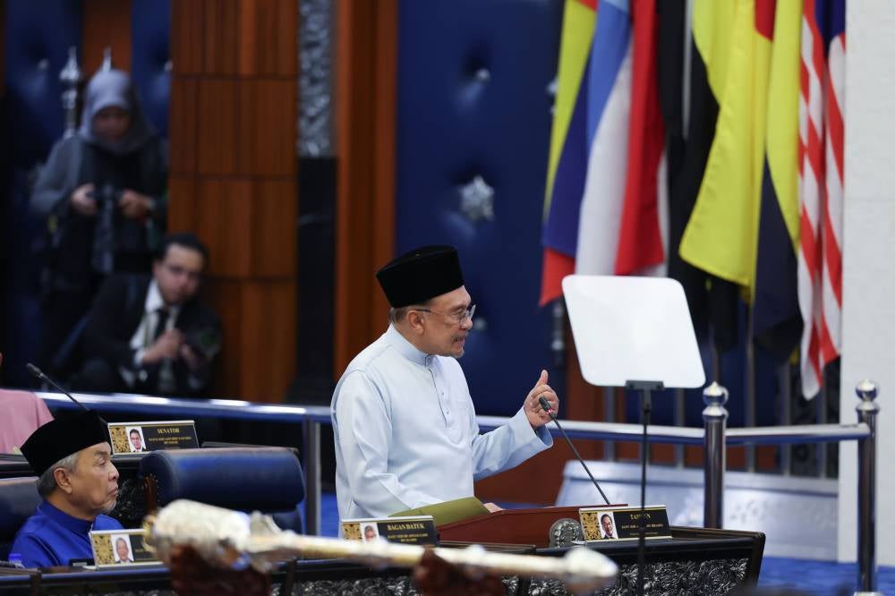 Finance Minister and Prime Minister Datuk Seri Anwar Ibrahim tabling the 2026 Budget at the Dewan Rakyat, yesterday. - Photo by Bernama