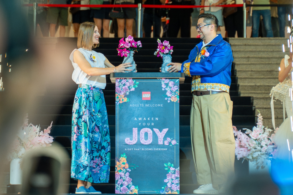 The Lego Group, Singapore, Malaysia and APAC Travel Retail, Marketing director, Ágnes Molnar (left) and Malaysia Official Designers Association (Moda) president, Cyrus Chin (right) officiating the launch of the Lego Botanical Glasshouse Experience. - Photo courtesy of the Lego Group