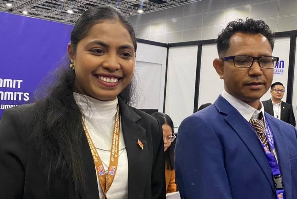 Remizia (left) being interviewed by reporters at the International Media Centre (IMC) in KLCC on Sunday. Photo by Sinar Harian/Aisyah Basaruddin.